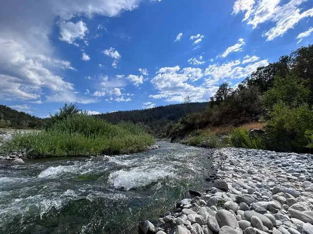 a view of lake with green space