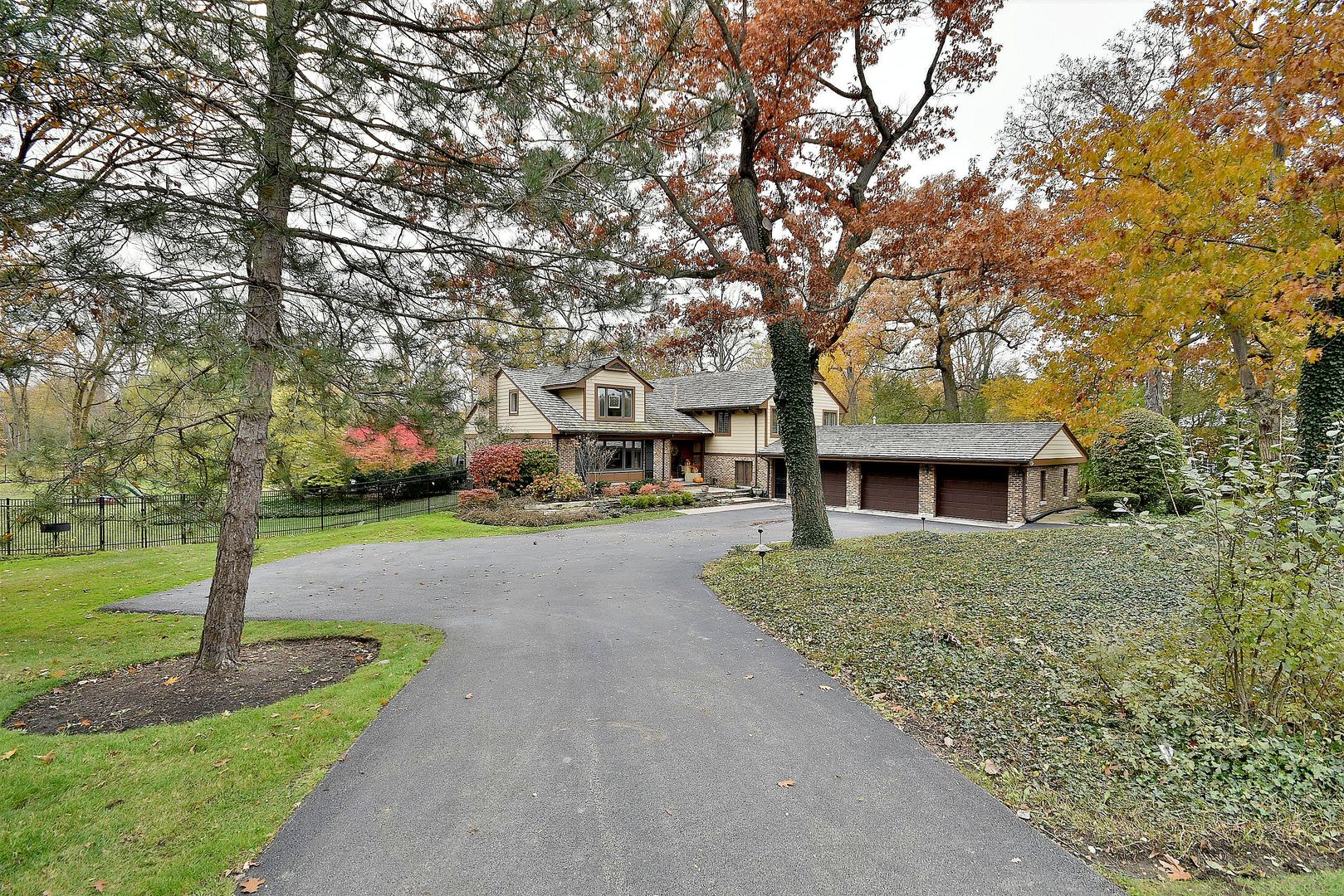 1700 North Happ Road Northbrook, IL 60062 - Photo 1 of 1 a front view of a house with yard and tree