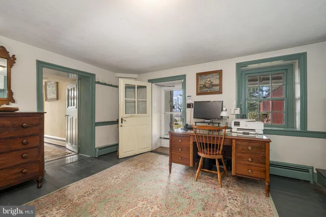 a view of bedroom with furniture and wooden floor