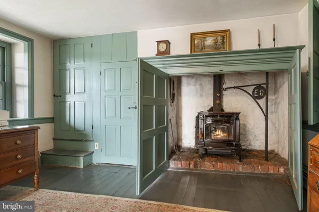 a bedroom with furniture and a rug