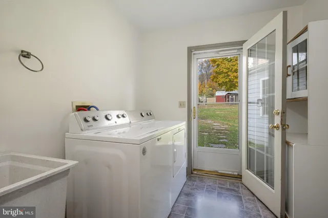 a bathroom with a sink and a window
