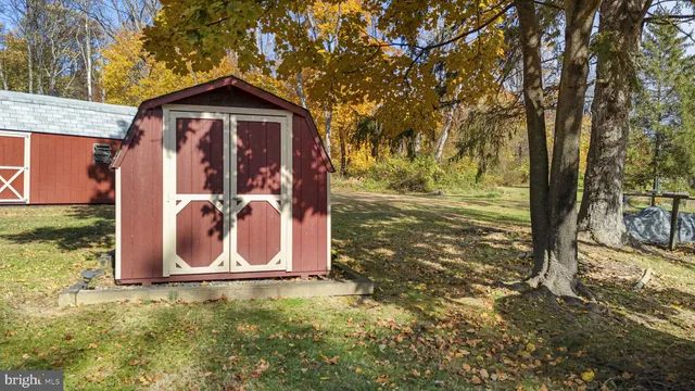 a living room with furniture and a piano