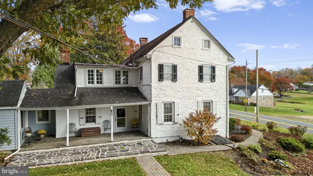 a view of entryway with furniture and wooden floor