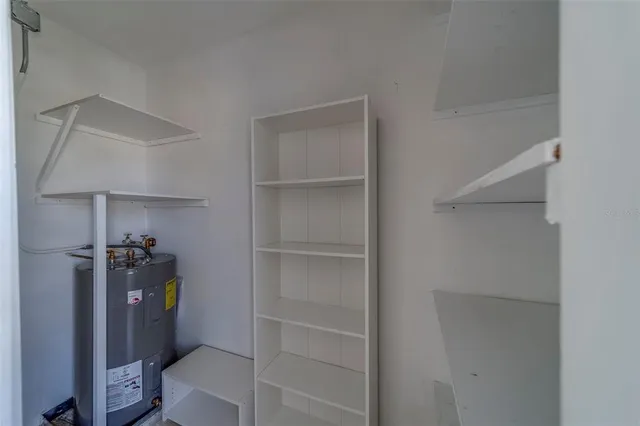 a view of an empty room and wooden floor