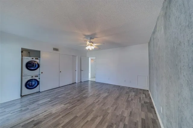 a view of livingroom with hardwood floor and hallway