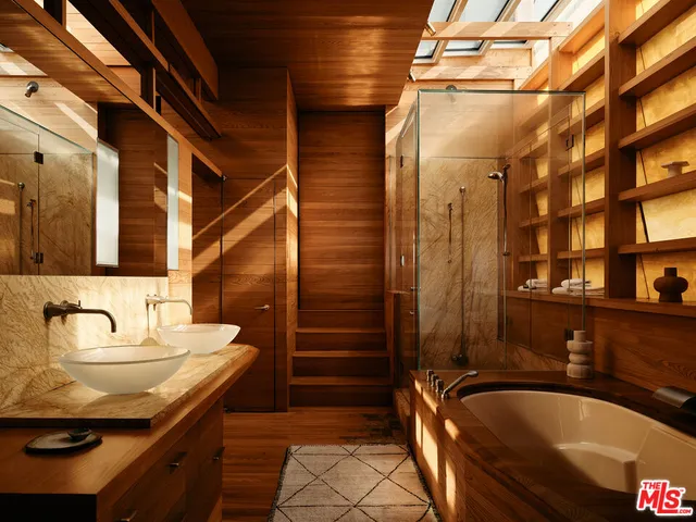 a bathroom with a tub and sink