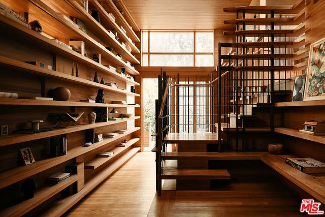 a view of a living room with furniture and a window