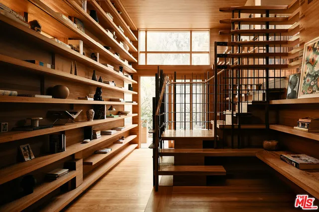 a view of a living room with furniture and a window