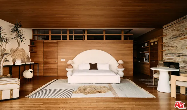 a living room with furniture fireplace and flat screen tv