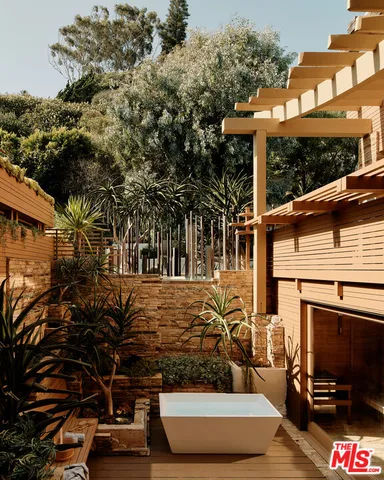 a view of balcony with couches and ocean view