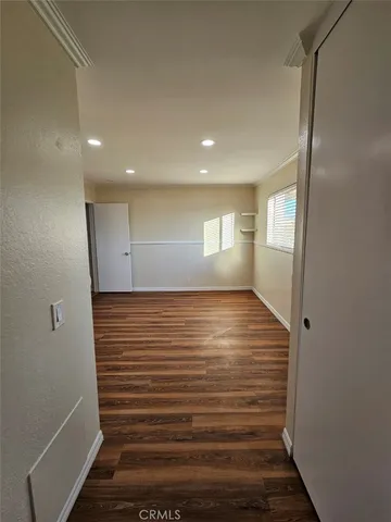 a view of an empty room with windows