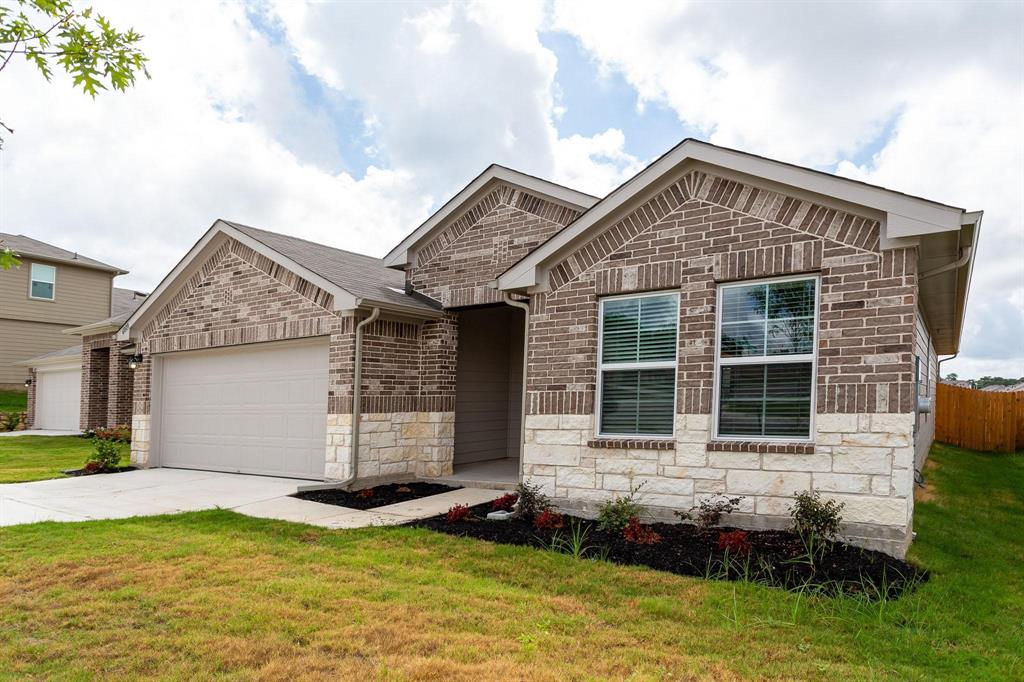 6009 Ronee Leah Drive Austin, TX 78724 - Photo 2 of 16 Attractive brick and stone facade adorns this well-maintained residence, complete with an attached garage.