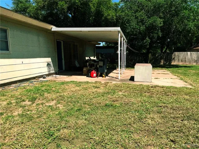 a view of a chair and tables in patio of the house