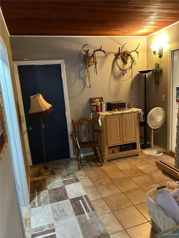 a room with gym equipment and a mirror