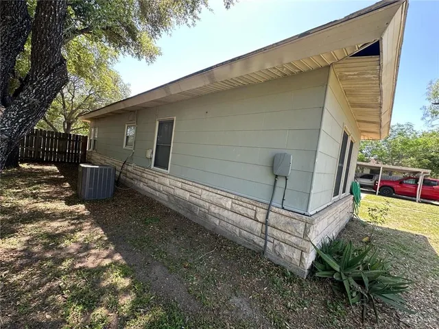 a backyard of a house with seating space