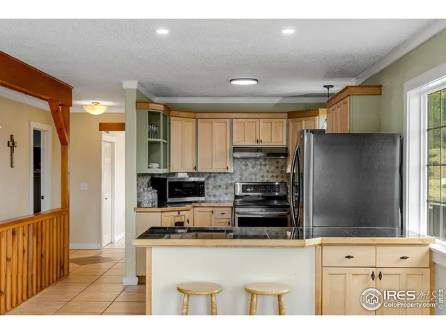 a view of a sink and a large window