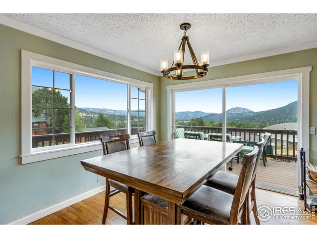 a view of a balcony with table and chairs