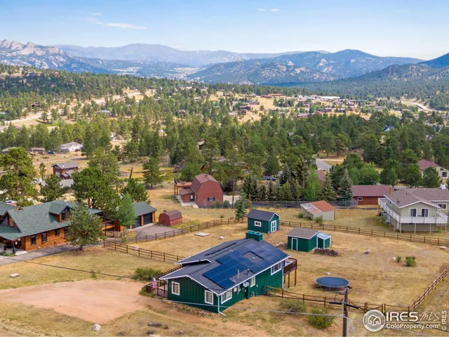 an aerial view of residential houses and outdoor space