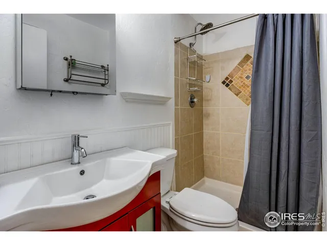 an aerial view of a house with a big yard