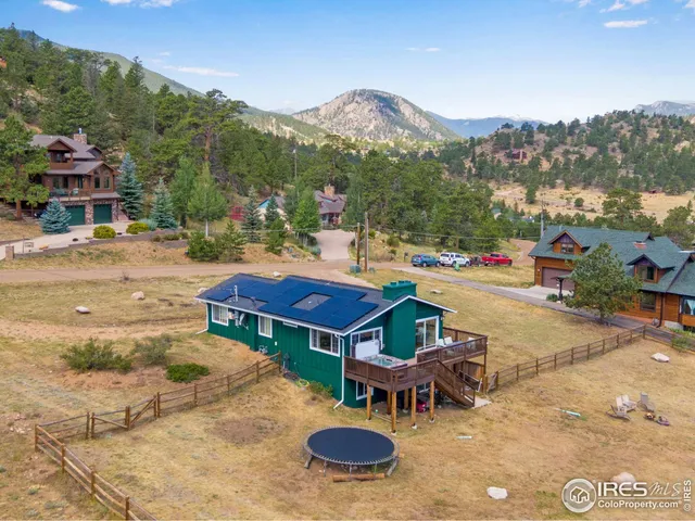 a view of a terrace with a table and chairs