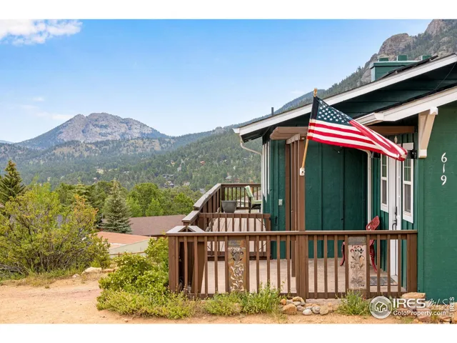 a view of a patio with a table and chairs