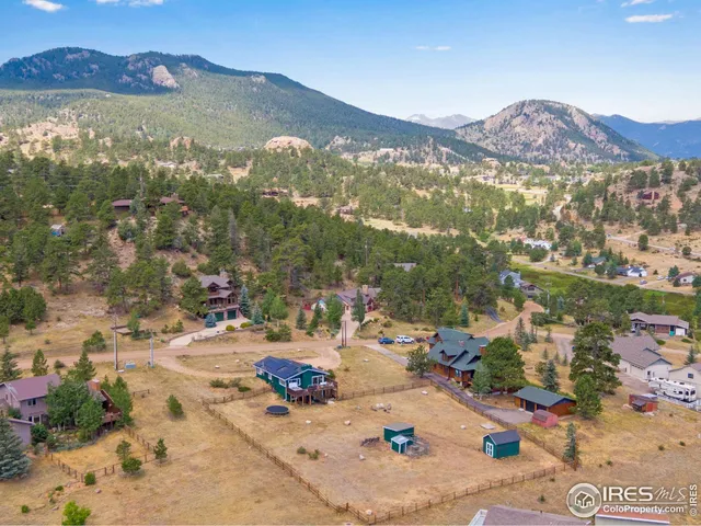 an aerial view of residential house with an outdoor space