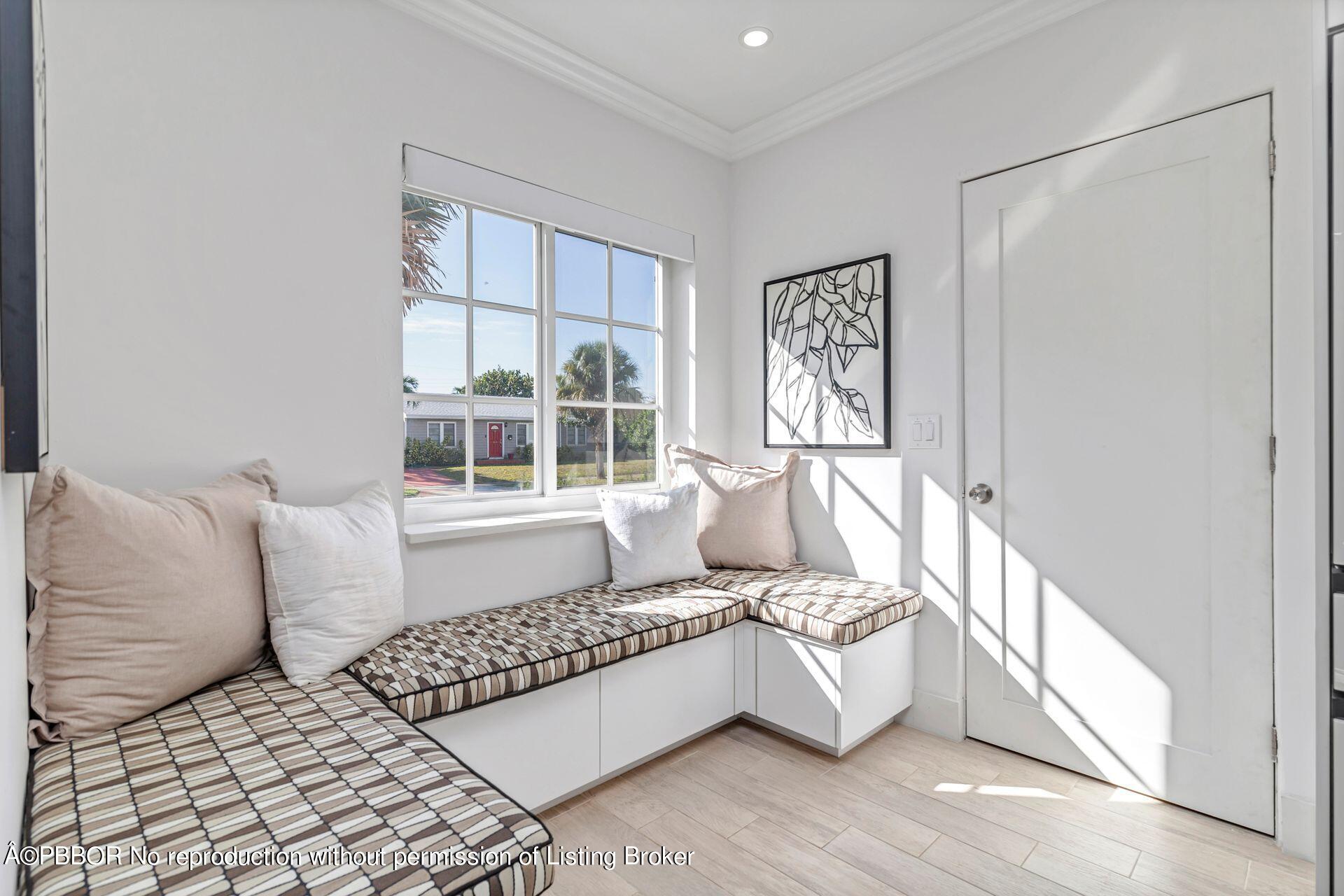 361 Franklin Road West Palm Beach, FL 33405 - Photo 12 of 32 a large white bed sitting in a room next to a window