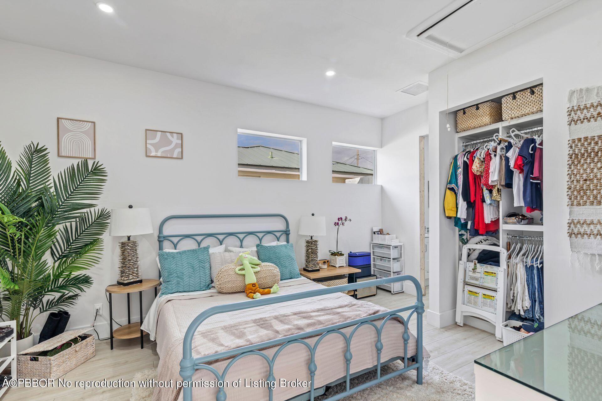 361 Franklin Road West Palm Beach, FL 33405 - Photo 17 of 32 a bedroom with a bed and a potted plant