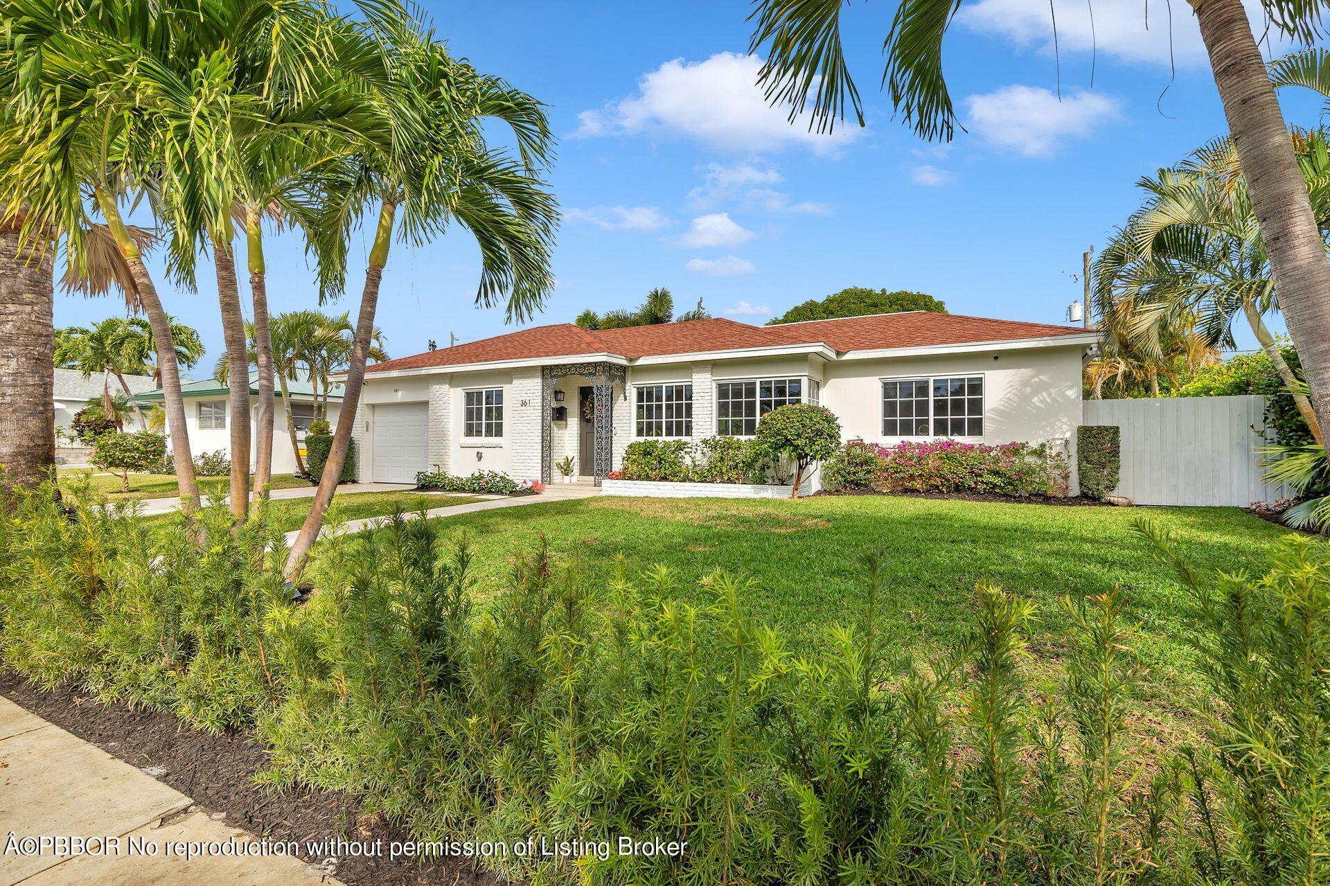 361 Franklin Road West Palm Beach, FL 33405 - Photo 2 of 32 a front view of a house with a garden