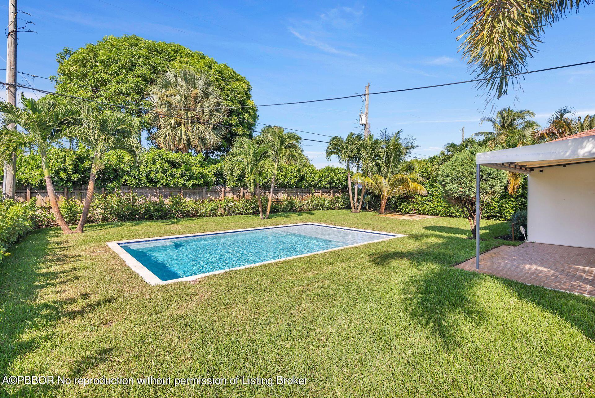 361 Franklin Road West Palm Beach, FL 33405 - Photo 22 of 32 a view of a swimming pool with an outdoor space