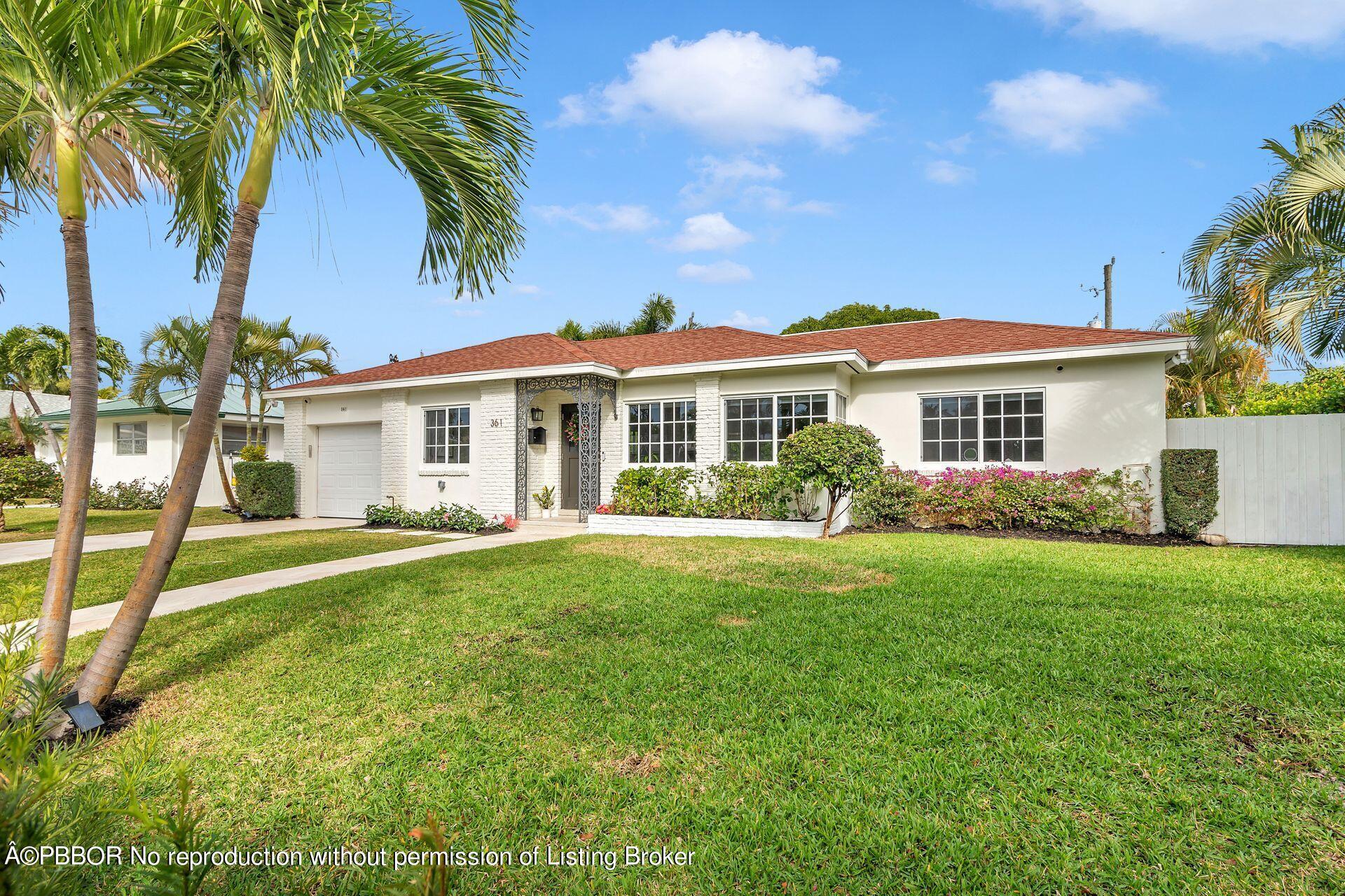 361 Franklin Road West Palm Beach, FL 33405 - Photo 26 of 32 a front view of a house with a garden