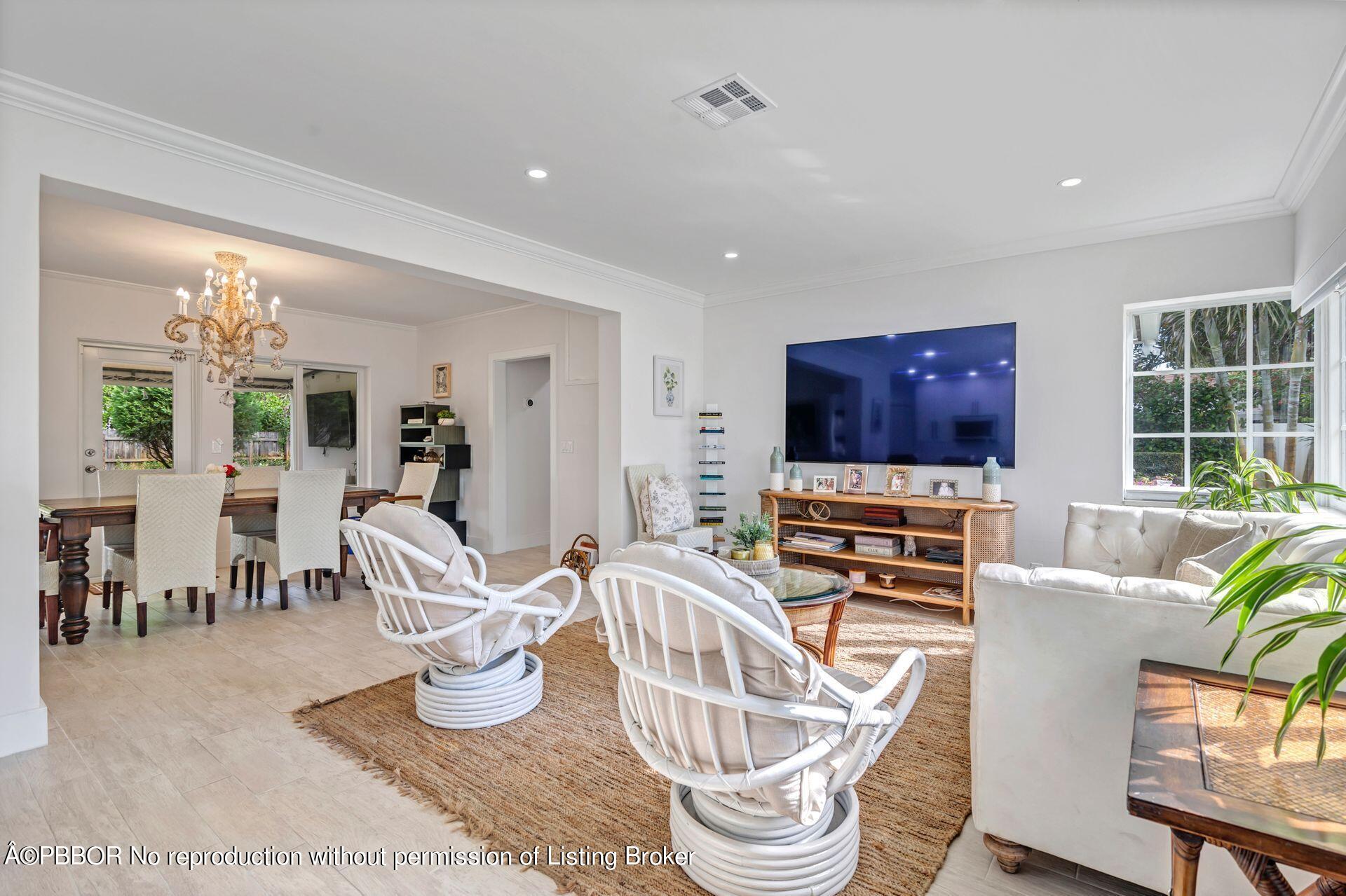 361 Franklin Road West Palm Beach, FL 33405 - Photo 4 of 32 a living room with furniture a flat screen tv and kitchen view