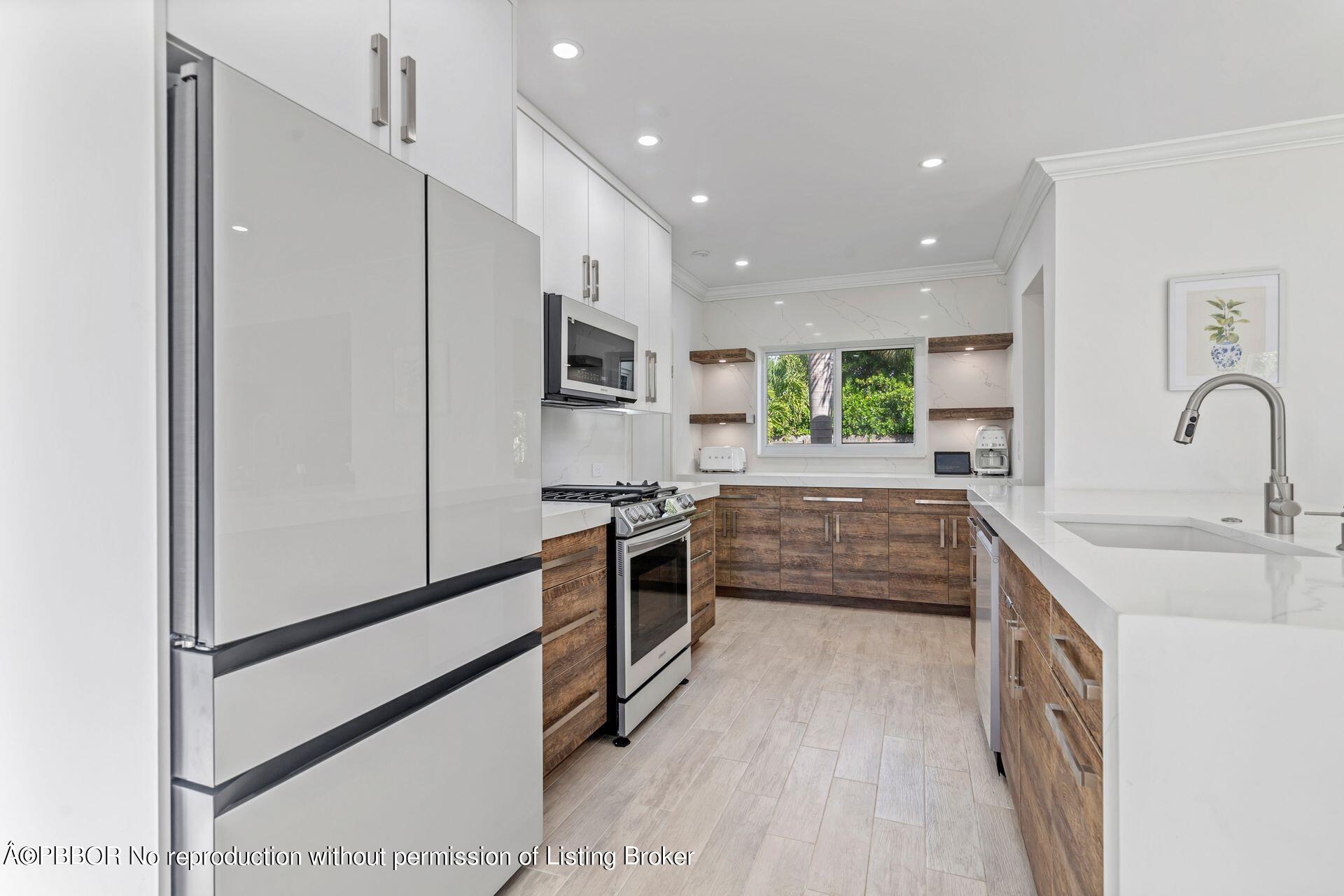 361 Franklin Road West Palm Beach, FL 33405 - Photo 10 of 32 a kitchen with stainless steel appliances a refrigerator sink and microwave