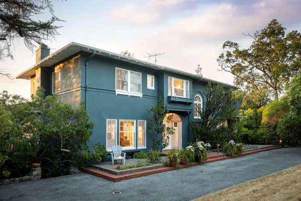a front view of a house with garden