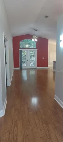 a view of a room with a fireplace and window