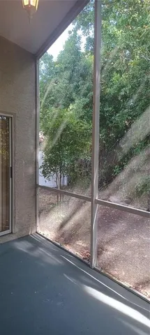 a view of a house with a forest