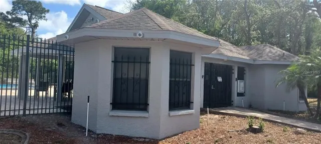 a view of house with backyard