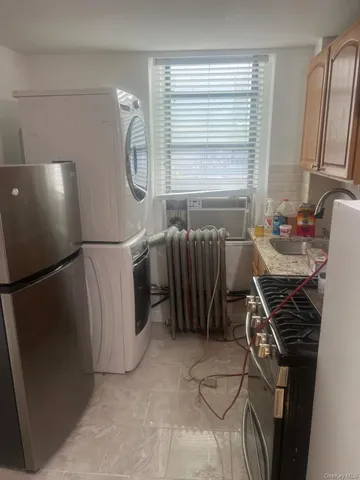 a view of a kitchen with furniture and a window