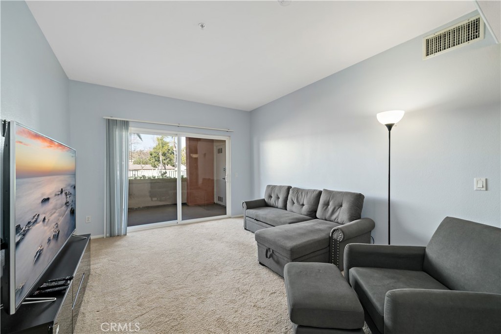 31214 Taylor Lane Temecula, CA 92592 - Photo 6 of 24 a living room with furniture and a flat screen tv