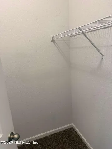 a view of small space with racks on the wall