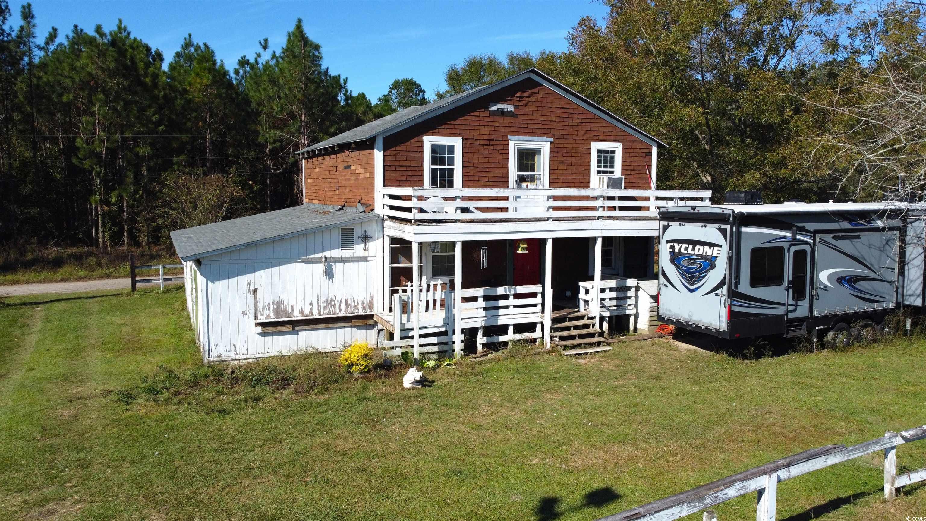 6873 Cribb Road Mullins, SC 29574 - Photo 1 of 28 Front of cabin with a lawn and a porch