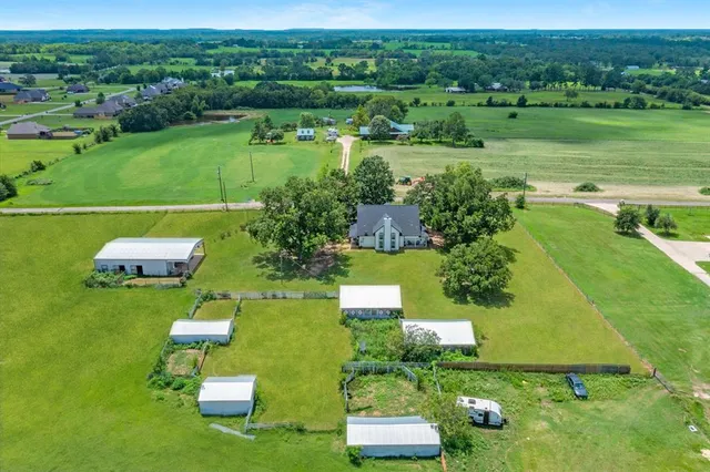 a view of a golf course with chairs