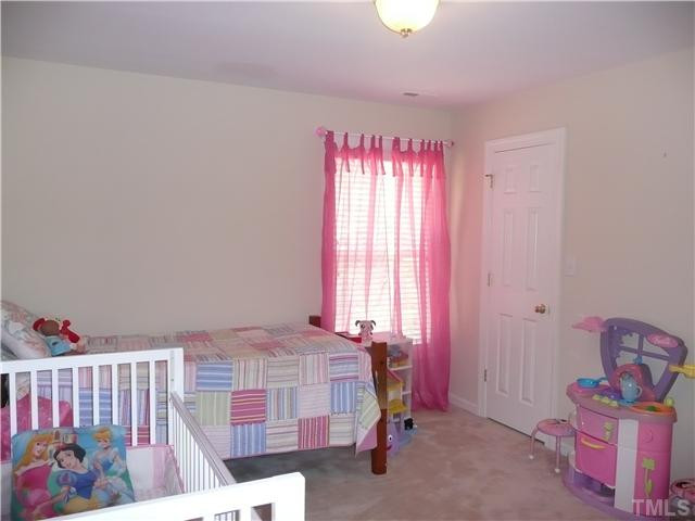 2812 Kissing Court Raleigh, NC 27613 - Photo 13 of 24 Secondary bedroom has walk in closet and shares hall bath. Bedroom