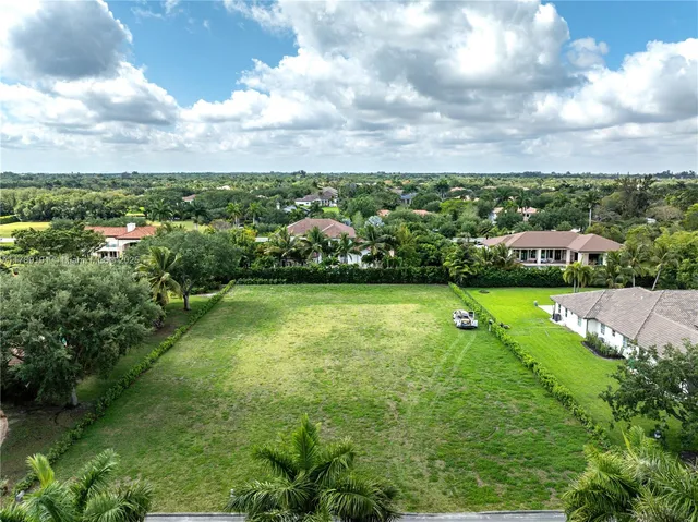 a view of a garden with houses