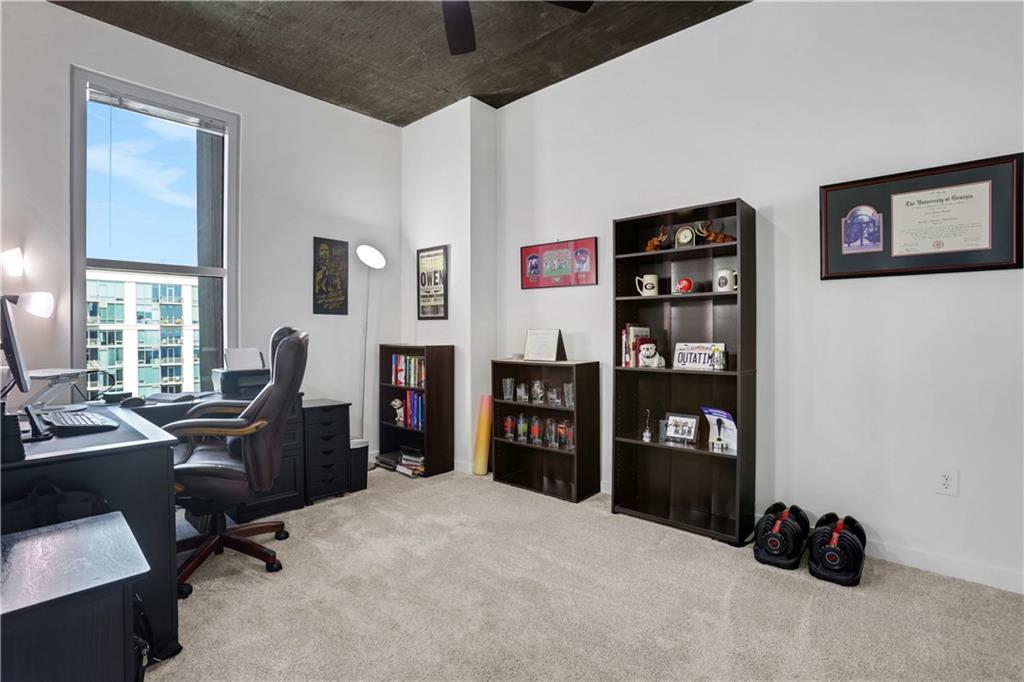 250 Pharr Road Northeast, Unit 2005 Atlanta, GA 30305 - Photo 19 of 49 a view of a livingroom with workspace and a window