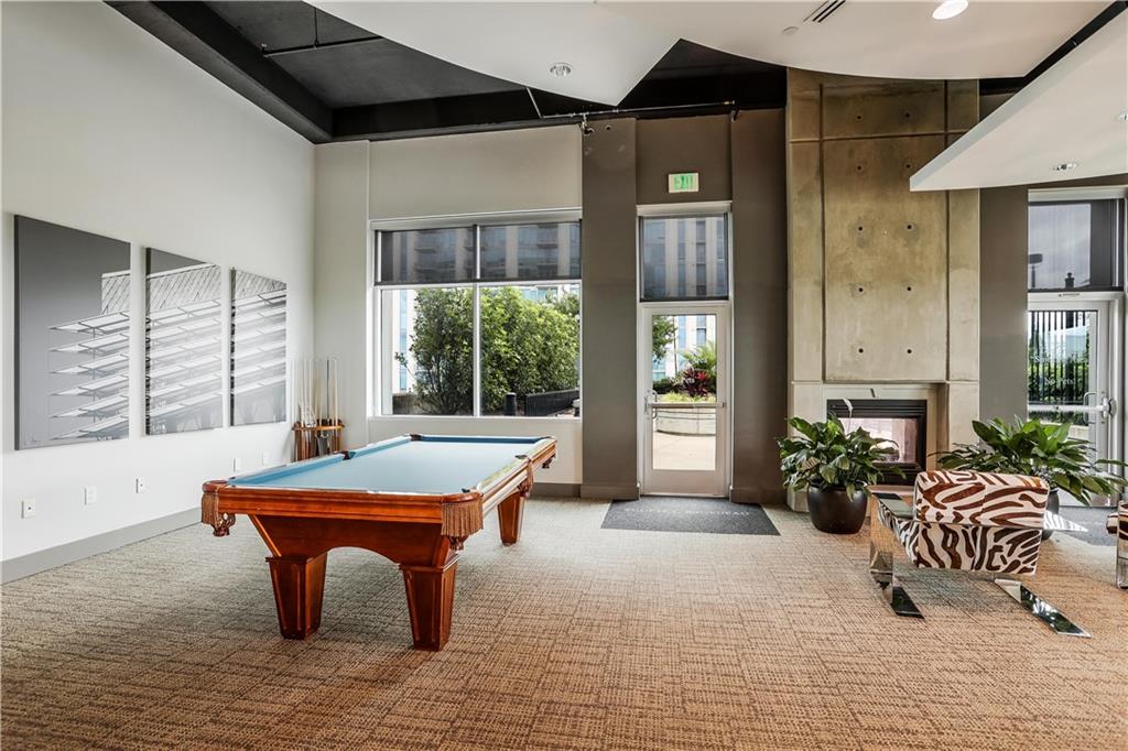 250 Pharr Road Northeast, Unit 2005 Atlanta, GA 30305 - Photo 38 of 49 a room with pool table and windows