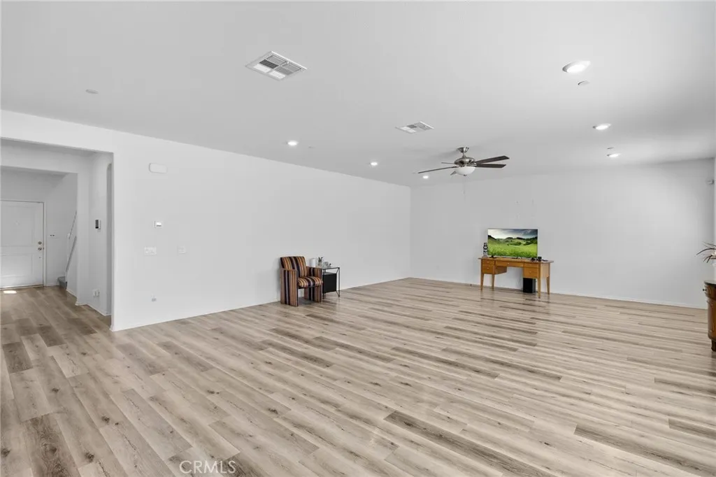 12487 Sunset Road Victorville, CA 92392 - Photo 11 of 44 a view of a room with wooden floor