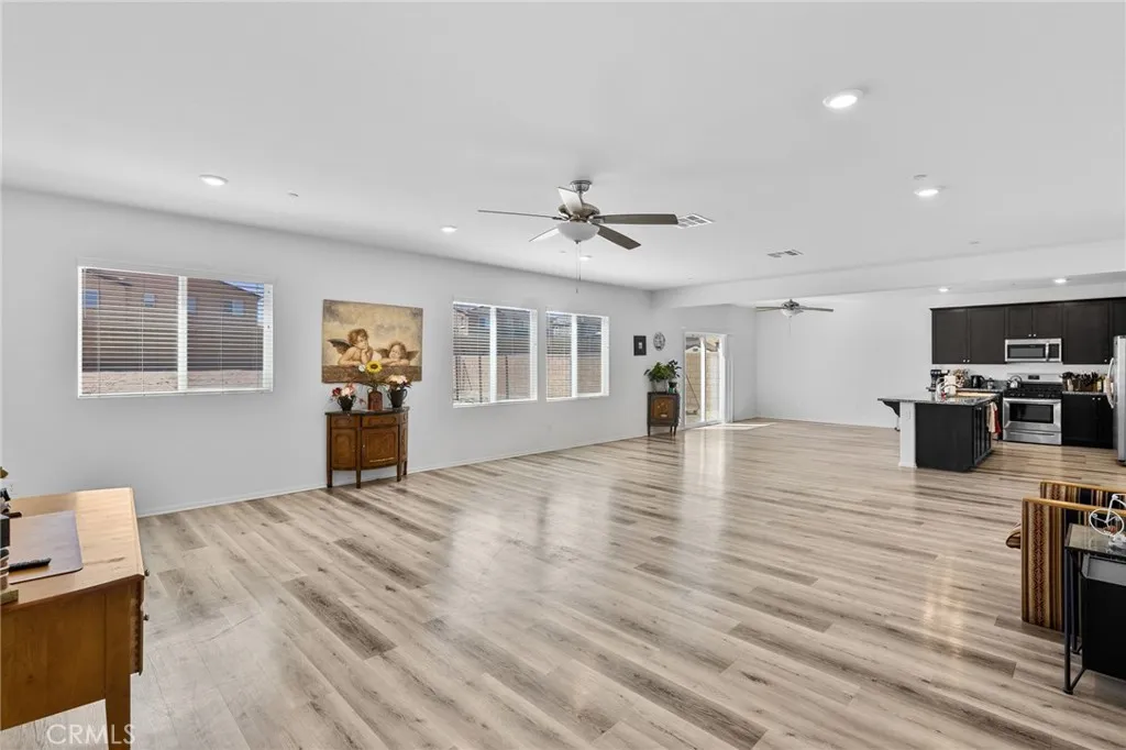 12487 Sunset Road Victorville, CA 92392 - Photo 13 of 44 a view of a kitchen with furniture and wooden floor