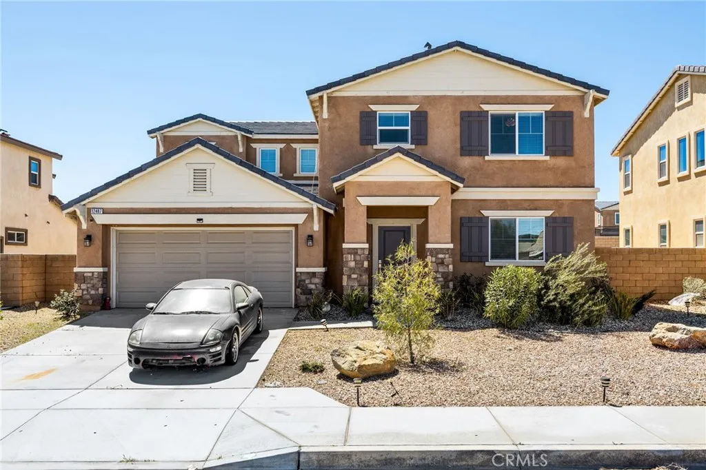 12487 Sunset Road Victorville, CA 92392 - Photo 2 of 44 a front view of a house with cars parked