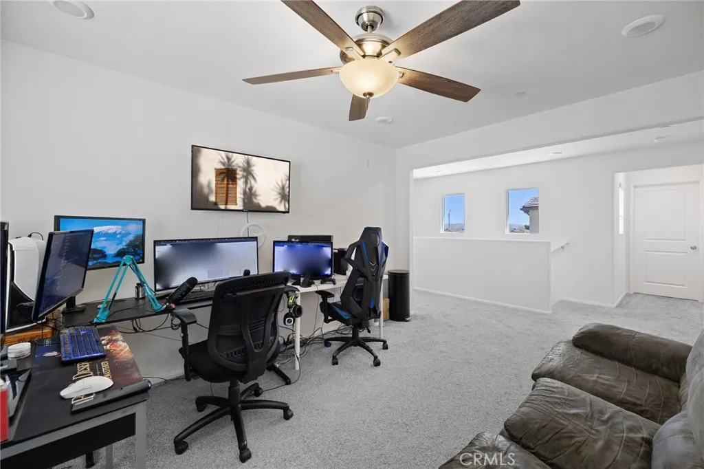 12487 Sunset Road Victorville, CA 92392 - Photo 27 of 44 a view of a workspace with furniture and a window